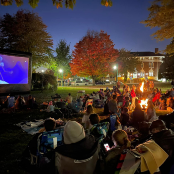 community movie event at night on village green