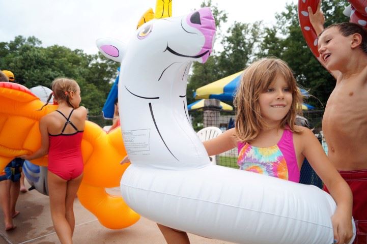 Float parade marches around the family aquatic center